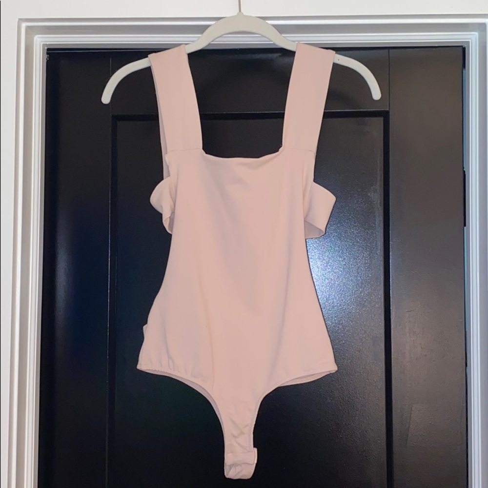 Free People “Oh she’s strapped duo bodysuit”